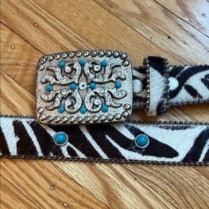 Leather Rock brand cow hair belt. Size large